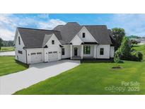 Charming modern farmhouse with a three-car garage, lush lawn and elegant black and white trim at 108 Augusta Ln, Shelby, NC 28150