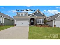 Charming single-Gathering home featuring stone accents and a well-manicured lawn at 152 Asmodean Ln, Troutman, NC 28166