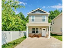 Charming two-story home with a welcoming front porch and manicured lawn at 2662 14Th Ne St, Hickory, NC 28601