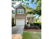 Beautiful home featuring a brick facade, attached garage, and nicely landscaped front yard at 2769 Sawbridge Ln, Gastonia, NC 28056
