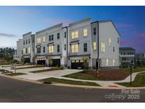 Stunning new construction townhomes with modern design and inviting curb appeal in a desirable neighborhood at 9212 Delancey Ln # 63, Concord, NC 28027
