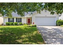 Charming single-story home with well-manicured lawn and attached two-car garage at 1668 Tate Rd, Rock Hill, SC 29732