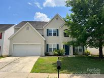 Charming two-story home with a two car garage and manicured lawn at 3022 Hendricks Chapel Ln, Charlotte, NC 28216
