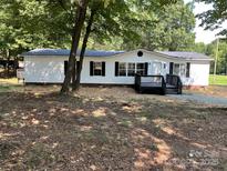 Charming single-story home with black shutters, front porch, and well-maintained landscaping at 6218 Old Pageland Marshville Rd, Marshville, NC 28103
