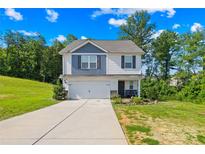 Charming two-story home featuring a classic design with a well-maintained lawn and a two car garage at 107 Frank Burns Way, Kings Mountain, NC 28086