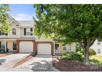 Charming townhome featuring a one car garage and well-maintained landscaping at 4520 Buck Skin Ct, Fort Mill, SC 29707