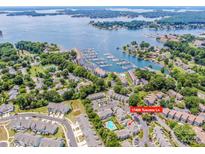 Stunning aerial view of community condos, marina, and Lake Norman in Cornelius, North Carolina at 17406 Tuscany Ln, Cornelius, NC 28031
