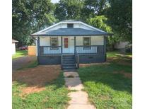 Charming single-story home with a cozy front porch and well-maintained lawn at 1919 Gay St, Statesville, NC 28625