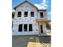New construction home with unfinished facade and visible framing details, showcasing modern design in progress at 2938 Clyde Dr # 31, Charlotte, NC 28208