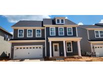 Charming new two-story home with a garage and craftsman-style details at 638 Amberjack Pl # 76, York, SC 29745