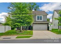 Charming two-story home featuring a well-manicured lawn and a two-car garage at 236 Robinwood Ln, Clover, SC 29710