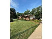 Charming ranch-style home with a well-manicured lawn and inviting front porch at 3085 Faith Rd, Salisbury, NC 28146
