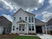 Beautiful two-story home featuring large windows, a covered porch, and attached garage at 4522 Splash Trl # 196, Sherrills Ford, NC 28673