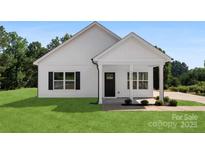 Charming home with a black front door, black shutters, and manicured lawn at 1019 S Main St, Granite Quarry, NC 28146