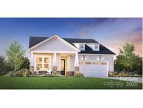 Charming home featuring a two-car garage, manicured lawn, and inviting front porch at 5309 Mint Harbor Way # 0313, Charlotte, NC 28269