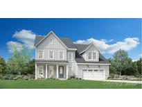 Charming two-story home with white siding, inviting front porch, and attached garage at 5361 Mint Harbor Way # 0301, Charlotte, NC 28269