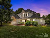 Charming two-story home with a well-manicured lawn and inviting front porch at 191 Harris Farm Rd, Mooresville, NC 28115