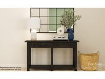 A hallway table is decorated with a lamp, vase, and stylish decor at 1616 Swallow Tail Dr, Cramerton, NC 28012