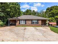 Charming single-story brick home with a spacious driveway and classic black shutters at 508 Gantt St # 1-2, Kings Mountain, NC 28086