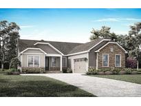 Charming single-story home with stone accents, attached garage, and well-maintained landscaping at 1312 Copper Leaf Dr, Rock Hill, SC 29732