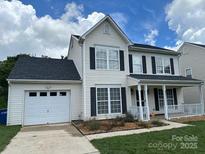 Charming two-story home with black shutters and a well-maintained lawn at 2113 Ballingarry Dr, Statesville, NC 28625