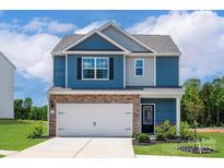 Charming two-story home with blue siding, stone accents, and a two-car garage at 7019 Jerimoth Dr, Charlotte, NC 28215