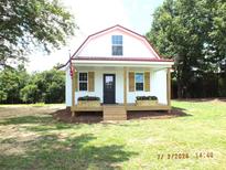 Charming small home with a inviting porch and quaint curb appeal at 1732 Rocky River Rd, Lancaster, SC 29720