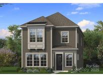 Charming two-story home with a well-manicured lawn and neutral siding, surrounded by lush greenery at 3127 Middle St # 95, Charlotte, NC 28278