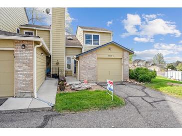 Charming townhome with well-kept lawn and a one car garage at 10520 W Fair Ave # A, Littleton, CO 80127