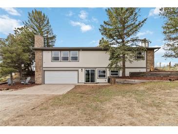 Charming two-story home with a two-car garage and stone accents at 1604 Lisbon Dr, Parker, CO 80138