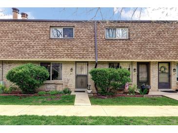 Charming townhouse with well-manicured front lawn and inviting entryway at 13017 W 20Th Ave, Golden, CO 80401
