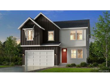 Charming two-story home with a two-car garage and a mix of dark and light siding at 13374 Blue Amber Ct, Parker, CO 80134
