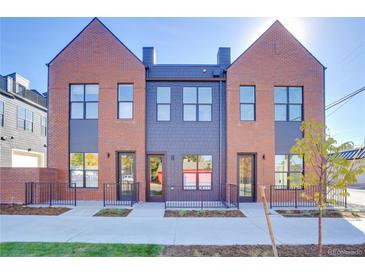 Charming brick townhomes with eye-catching windows, front stoops, and modern design at 5142 W 44Th Ave, Denver, CO 80212