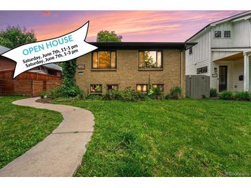 Charming brick home with a well-manicured lawn, inviting walkway, and an open house banner at 1111 Monroe St, Denver, CO 80206