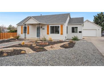 Charming home with attractive front yard landscaping and detached garage at 4455 Brentwood St, Wheat Ridge, CO 80033