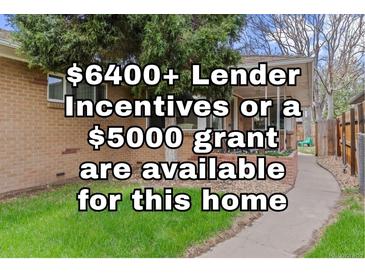 Charming single-story brick home with well-maintained lawn and inviting front porch at 3667 Hudson St, Denver, CO 80207
