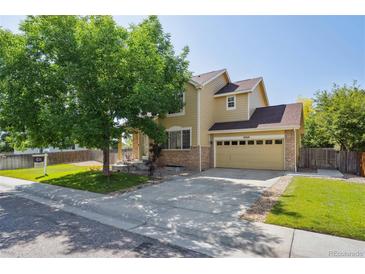Charming two-story home with a well-maintained lawn and a two-car garage, perfect for suburban living at 6260 E 114Th Ave, Thornton, CO 80233