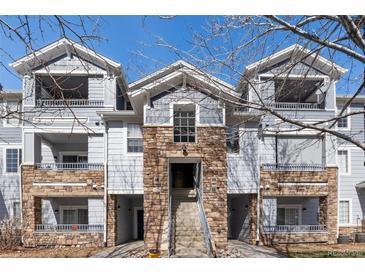 Attractive exterior view of a multi-Gathering home with stone accents, balconies, and well-maintained landscaping at 5255 Memphis St # 1112, Denver, CO 80239