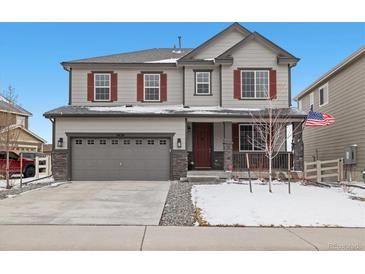 Charming two-story home featuring a gray exterior, red shutters, and a two-car garage at 3438 Cade Ct, Castle Rock, CO 80104