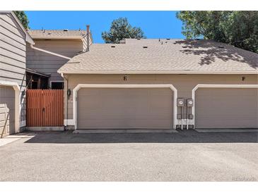 Attached garage with two parking spots and a gate at 3912 S Atchison Way # E, Aurora, CO 80014