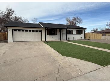 Charming single-story home featuring a two-car garage and well-maintained front yard at 5535 Clear Creek Dr, Denver, CO 80212