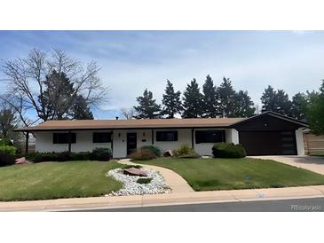 Charming single story home with well-manicured lawn and tasteful landscaping at 5886 S Logan St, Centennial, CO 80121
