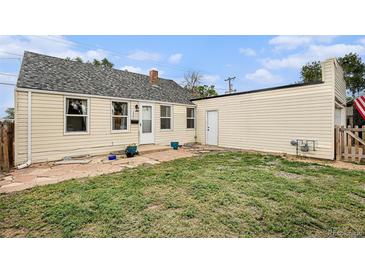 Cozy home featuring a well-maintained lawn and neutral exterior paint at 150 N 7Th Ave, Brighton, CO 80601