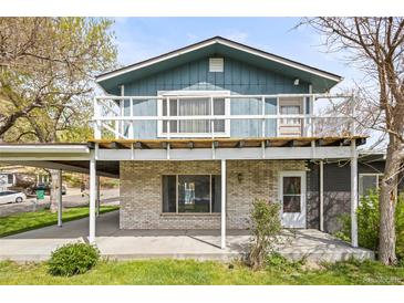 Charming two-story home with a spacious balcony and covered carport at 3995 Easley Rd, Golden, CO 80403