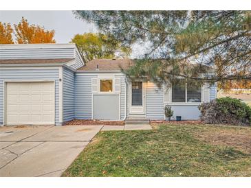 Charming single-story home with attached garage and well-maintained front lawn at 16179 E Rice Pl # B, Aurora, CO 80015