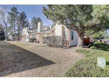 Charming townhouse with well-maintained landscaping and mature trees at 8300 S Upham Way, Littleton, CO 80128