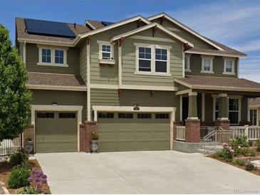 Exterior elevation of a two story house with a two car garage at 7899 S Country Club Pkwy, Aurora, CO 80016