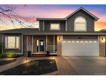 Charming two-story home featuring a well-manicured yard and brick accents at 5310 S Flanders Way, Centennial, CO 80015
