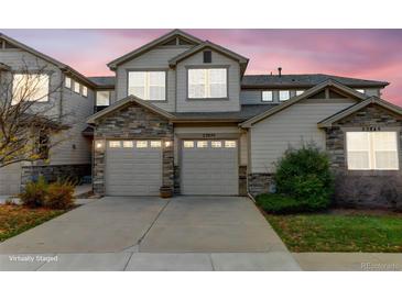 Charming townhome with stone accents and a two-car garage, perfect for modern living at 23070 York Ave, Parker, CO 80138