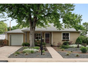 Charming single-story home with mature trees, well-manicured landscaping, and inviting curb appeal at 2925 S Harrison St, Denver, CO 80210
